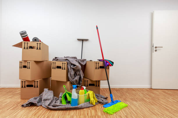 Clean, white room with cartons and cleaning tools